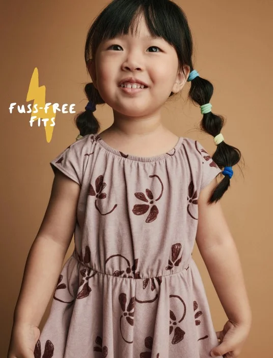 toddler girl in patterned dress