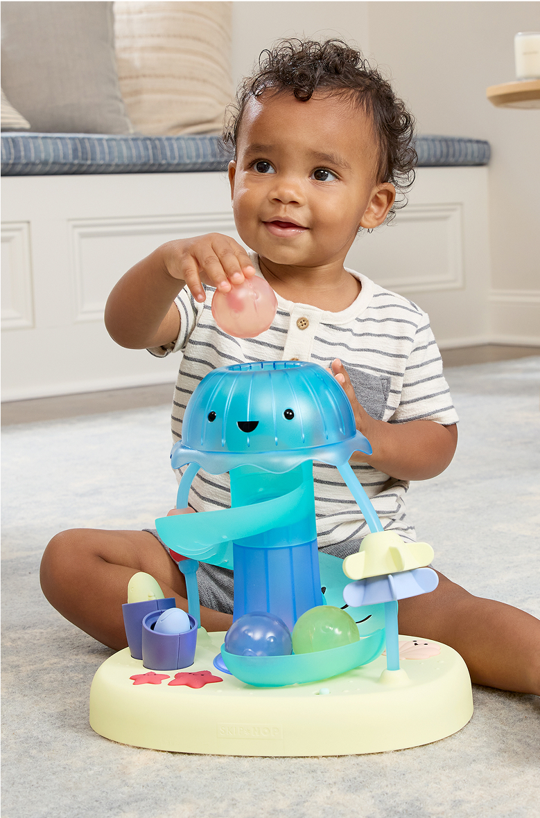 Baby playing with seascape toy