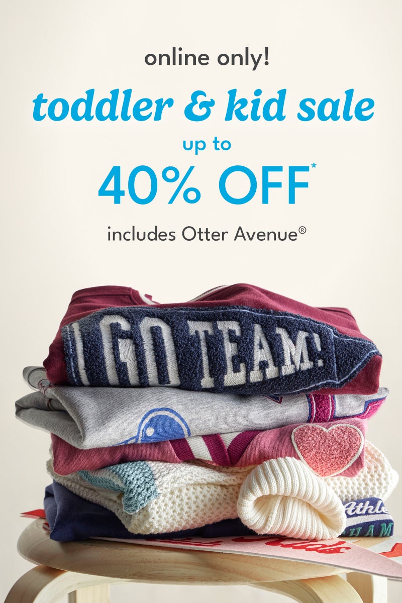 Pile of toddler and kid clothes with 40% off sale
