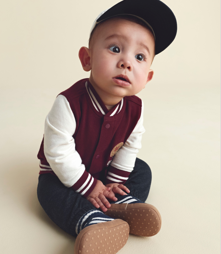 baby boy sitting in playful prep outfit