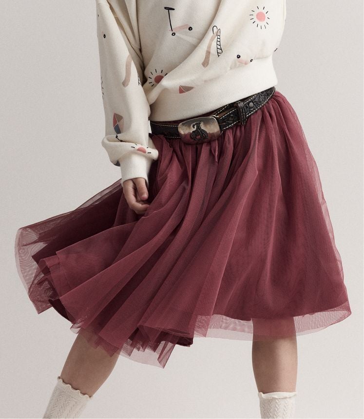 little girl twirling her skirt