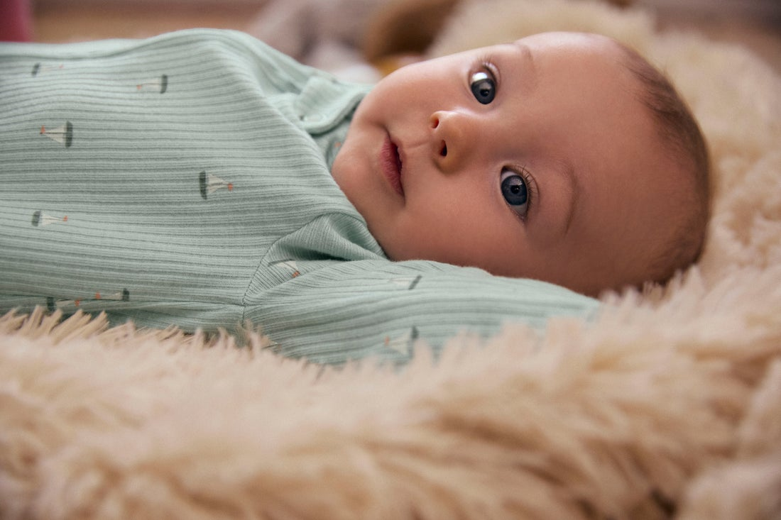 Baby lying on a blanket