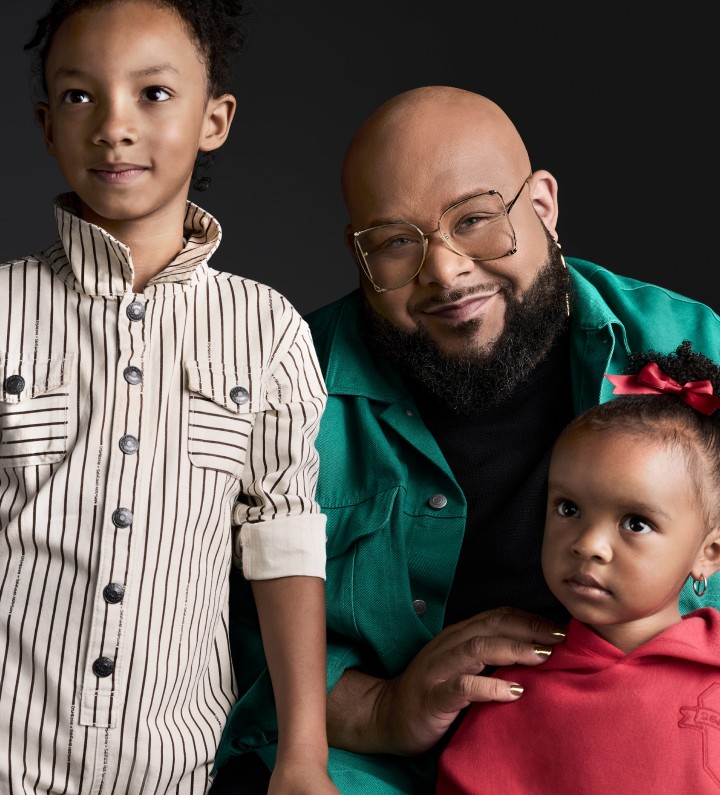 Fashion designer Sergio Hudson pictured with two children. 