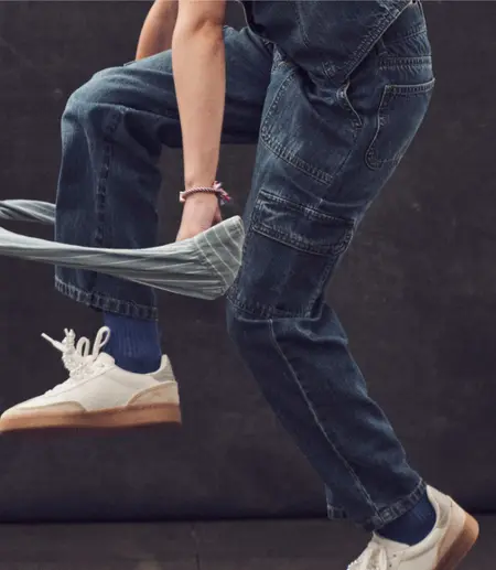 girl jumping over jacket