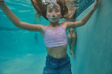 Kid swimming under water
