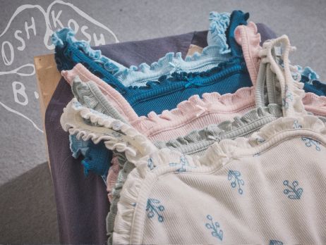 a stack of okb summer tank tops