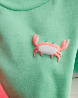 detail shot of a shirt with a crab