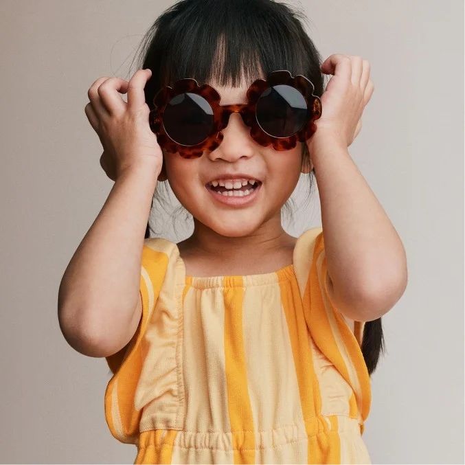 toddler girl in flower sunnies