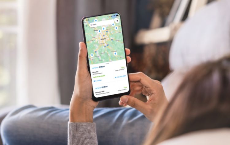 person holding a phone with a map leading to carter's store