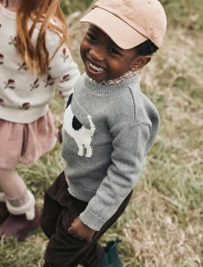 toddler boy in dog sweater