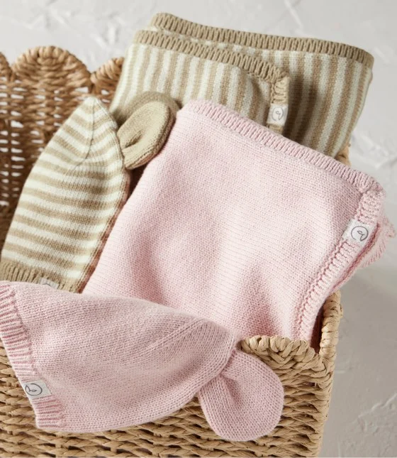 basket with baby blankets and accessories