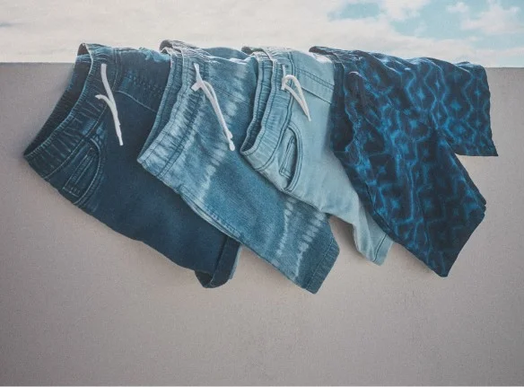 shorts on parking deck ledge