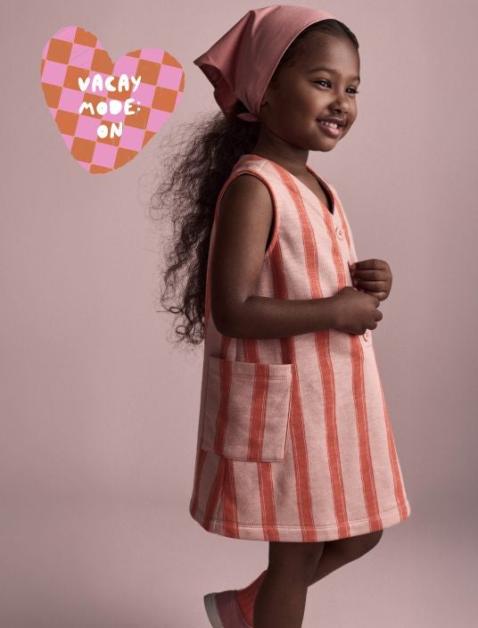 Toddler girl in striped dress