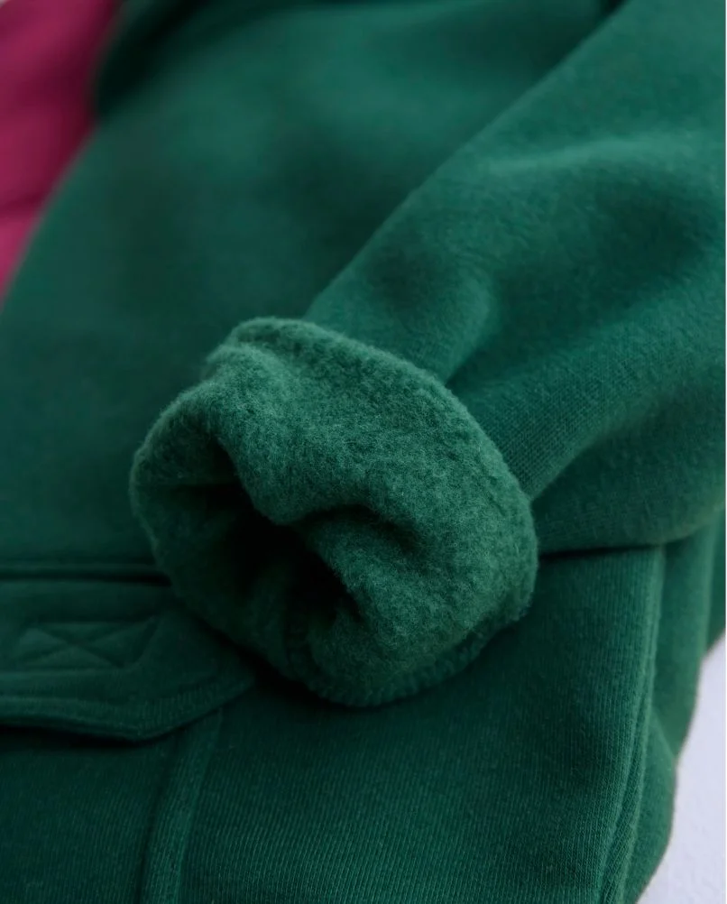 Green hoodie sleeve rolled