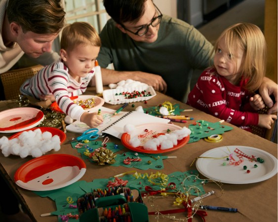 family sitting dinner table in PJs