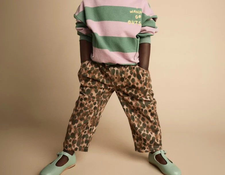 toddler girl in print bottoms