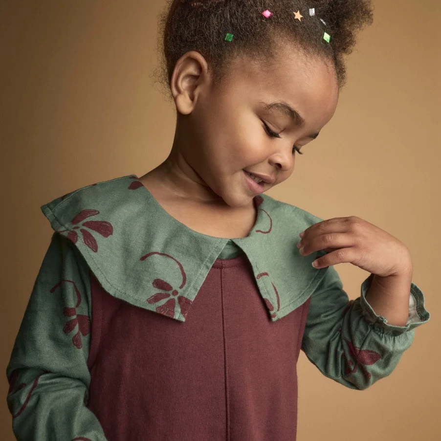 toddler girl in dress with collar