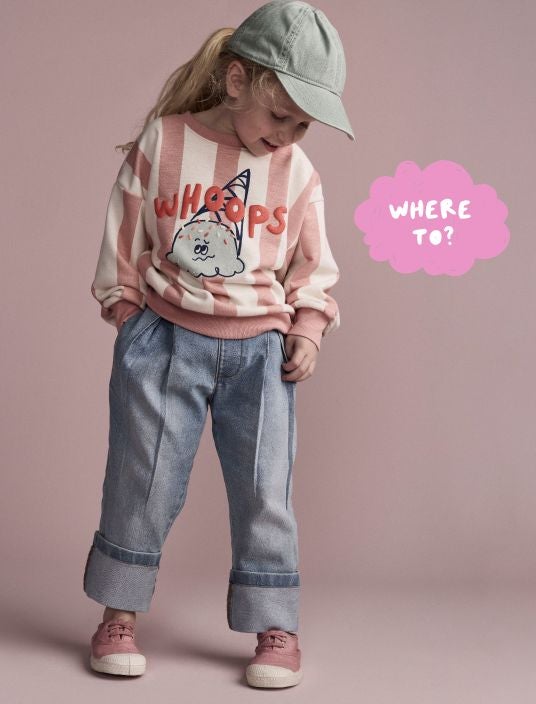 Toddler girl wearing sweatshirt and jeans