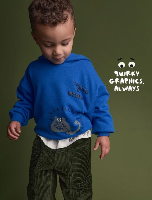 toddler boy in blue graphic hoodie