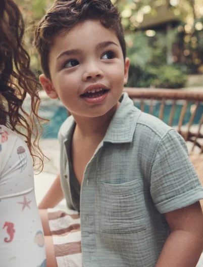 toddler boy in short sleeve gauze button up