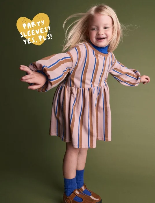 toddler girl in striped dress