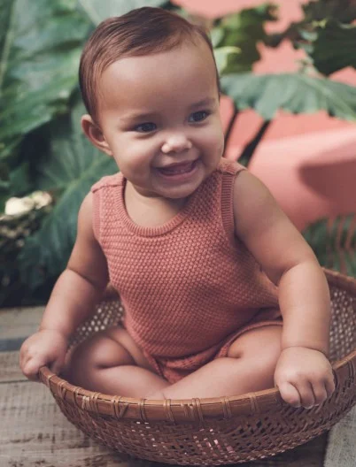 baby girl in matching knitted set