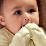 Baby with foldover mitts