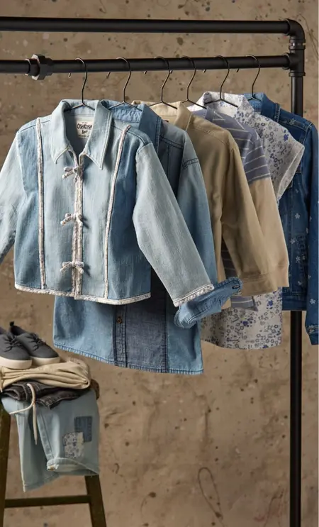 denim clothing hanging from a clothing rack