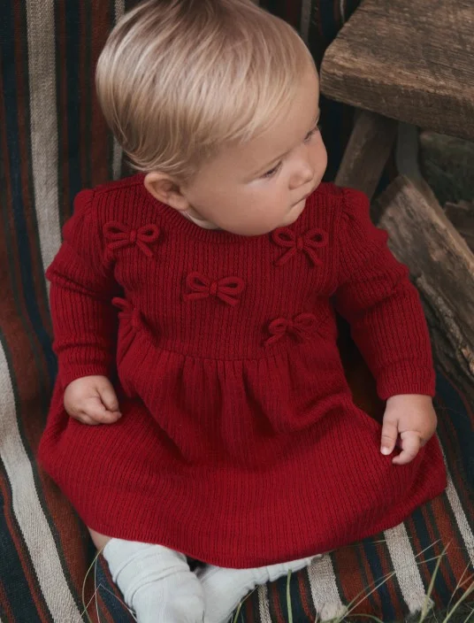 baby girl in in knit dress