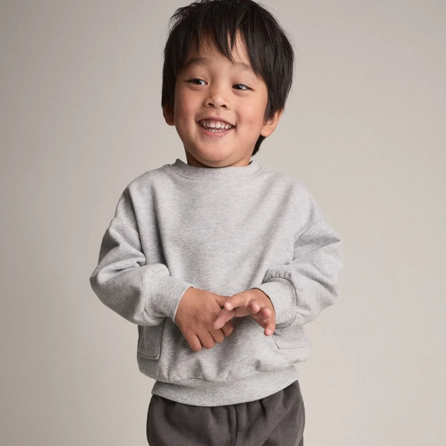 toddler boy in sweatshirt