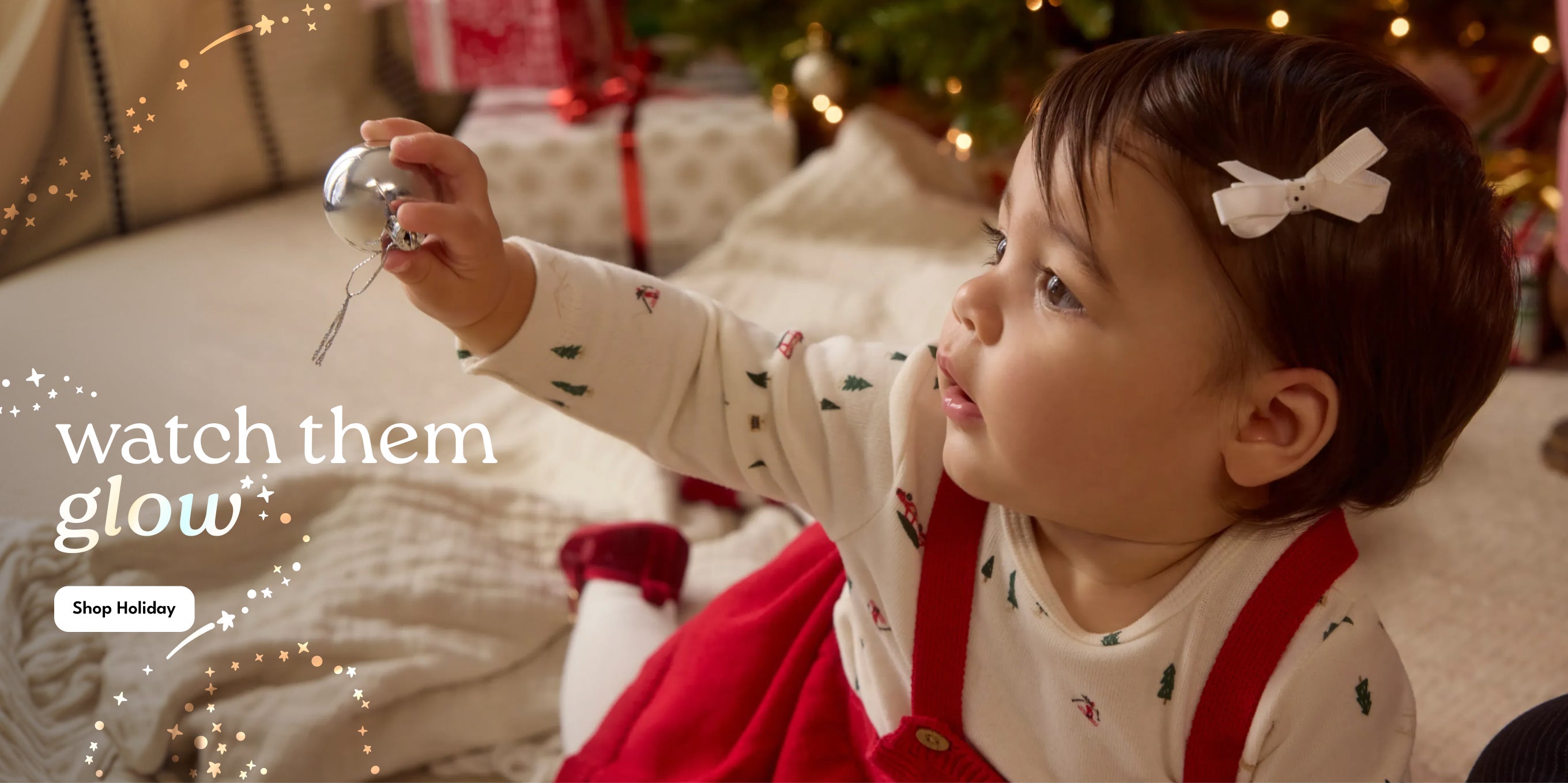 Watch them glow hero, baby looking at ornament 