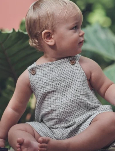 baby boy in one piece overalls