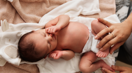 Baby lying on towel