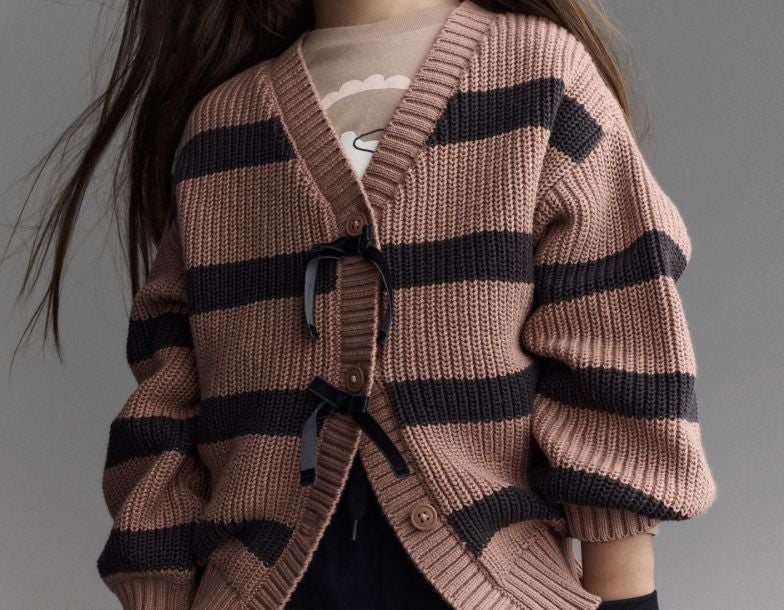 girl wearing shirt and sweater