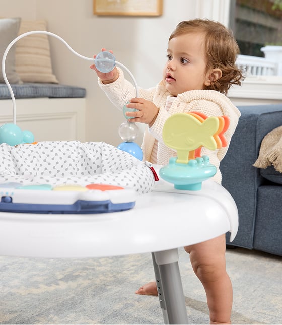 Baby in activity center