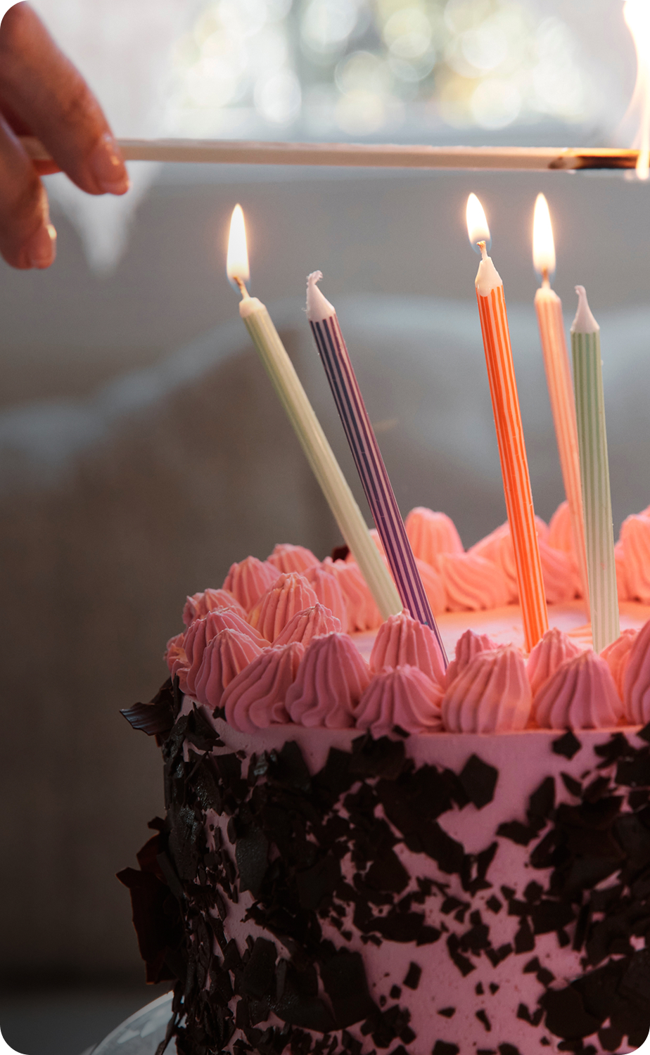 A birthday cake being lit