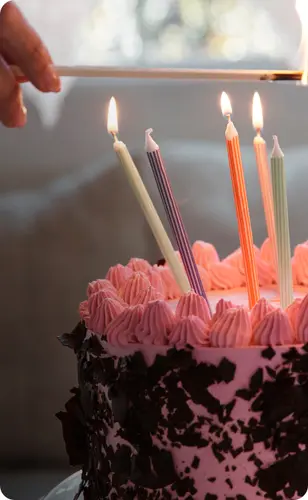 A birthday cake being lit